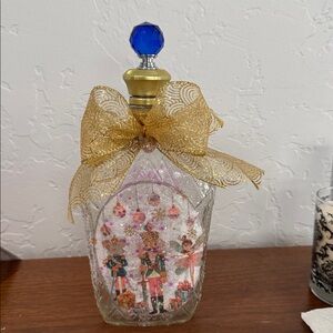 Decorative Glass Bottle with Gold Bow and Blue Top
